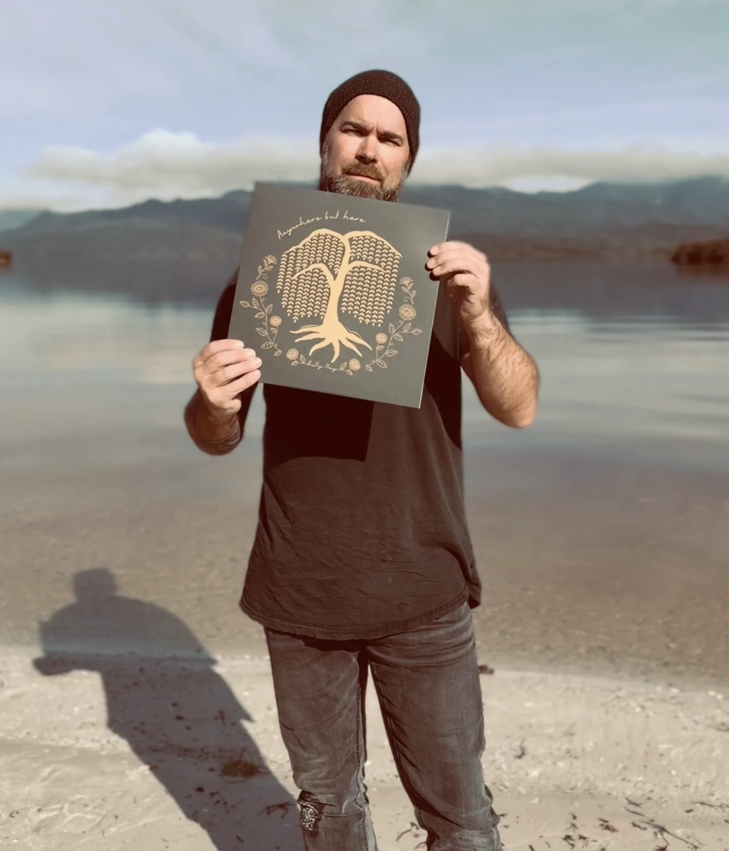 Bully Hay holding the Anywhere But Here vinyl